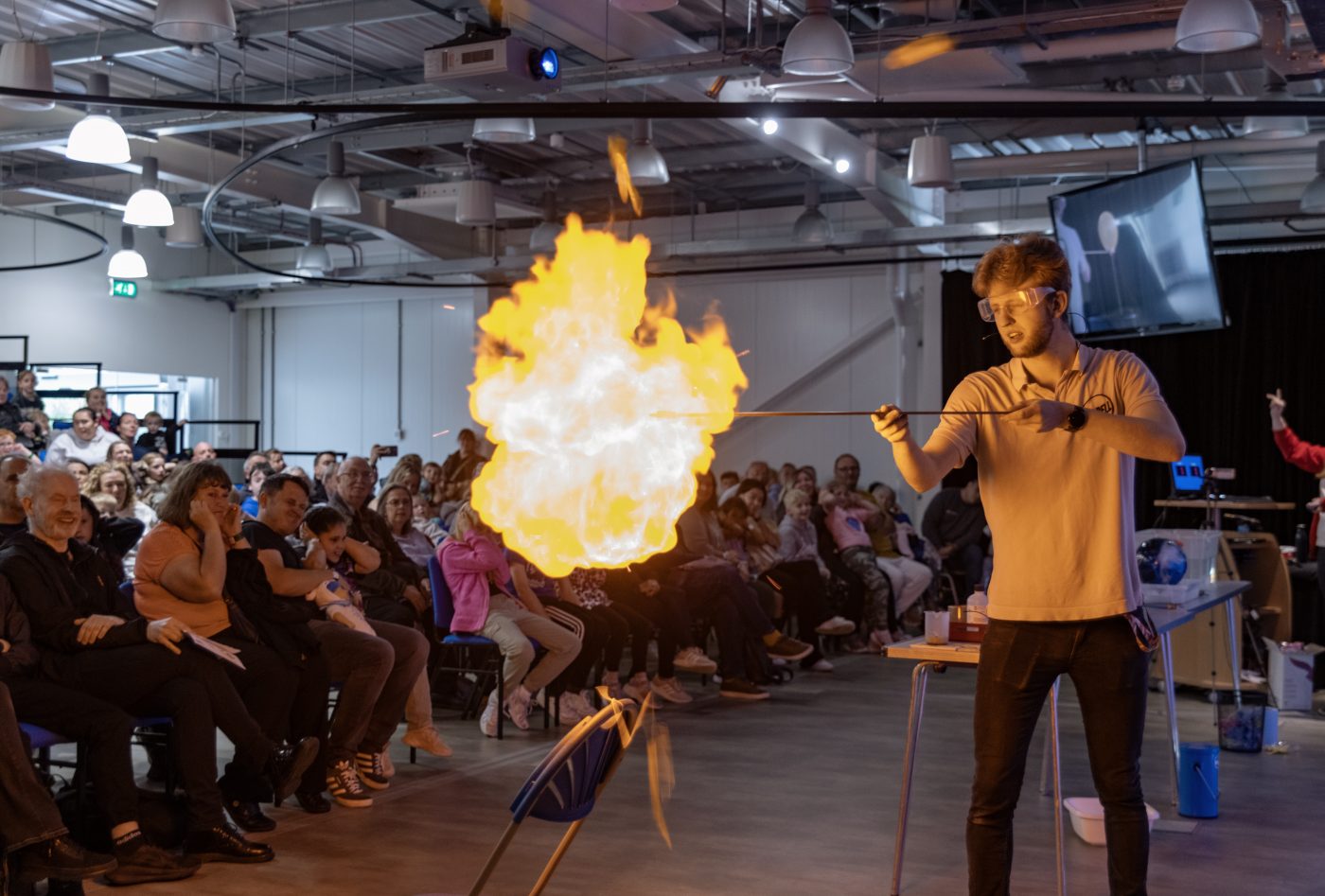 An Explainer ignites an explosion in a science show.