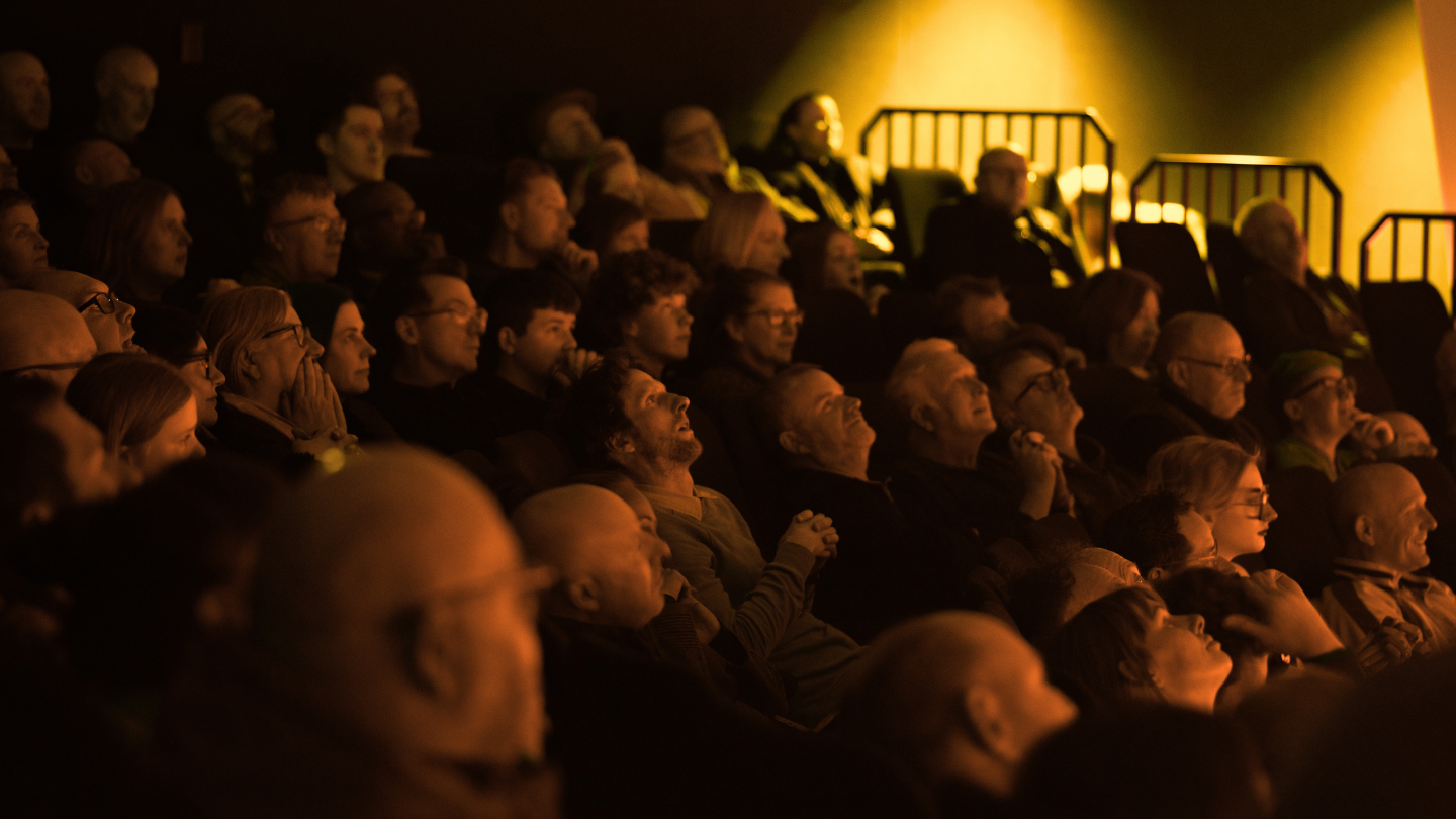 A photo of a crowd watching a Space Dome show,
