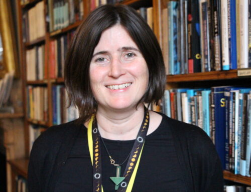 Dr Sian Prosser, a smiling woman with short brown hair and a yellow lanyard.