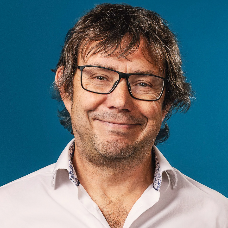 Headshot of Jeff Forshaw wearing a pale shirt and glasses
